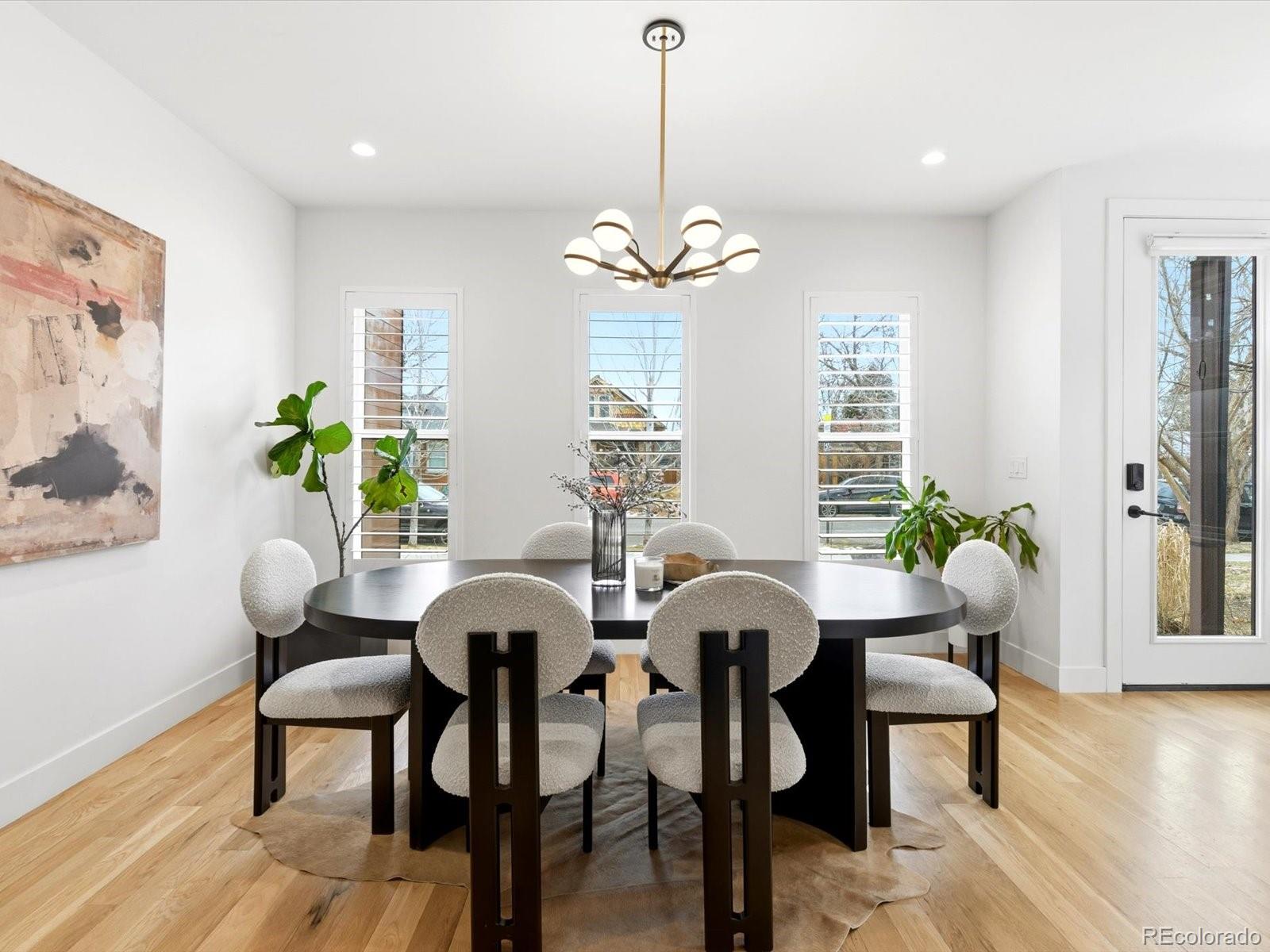 4141 Shoshone Street Denver, CO 80211 - Photo 7 of 50 a view of a dining room with furniture window and wooden floor