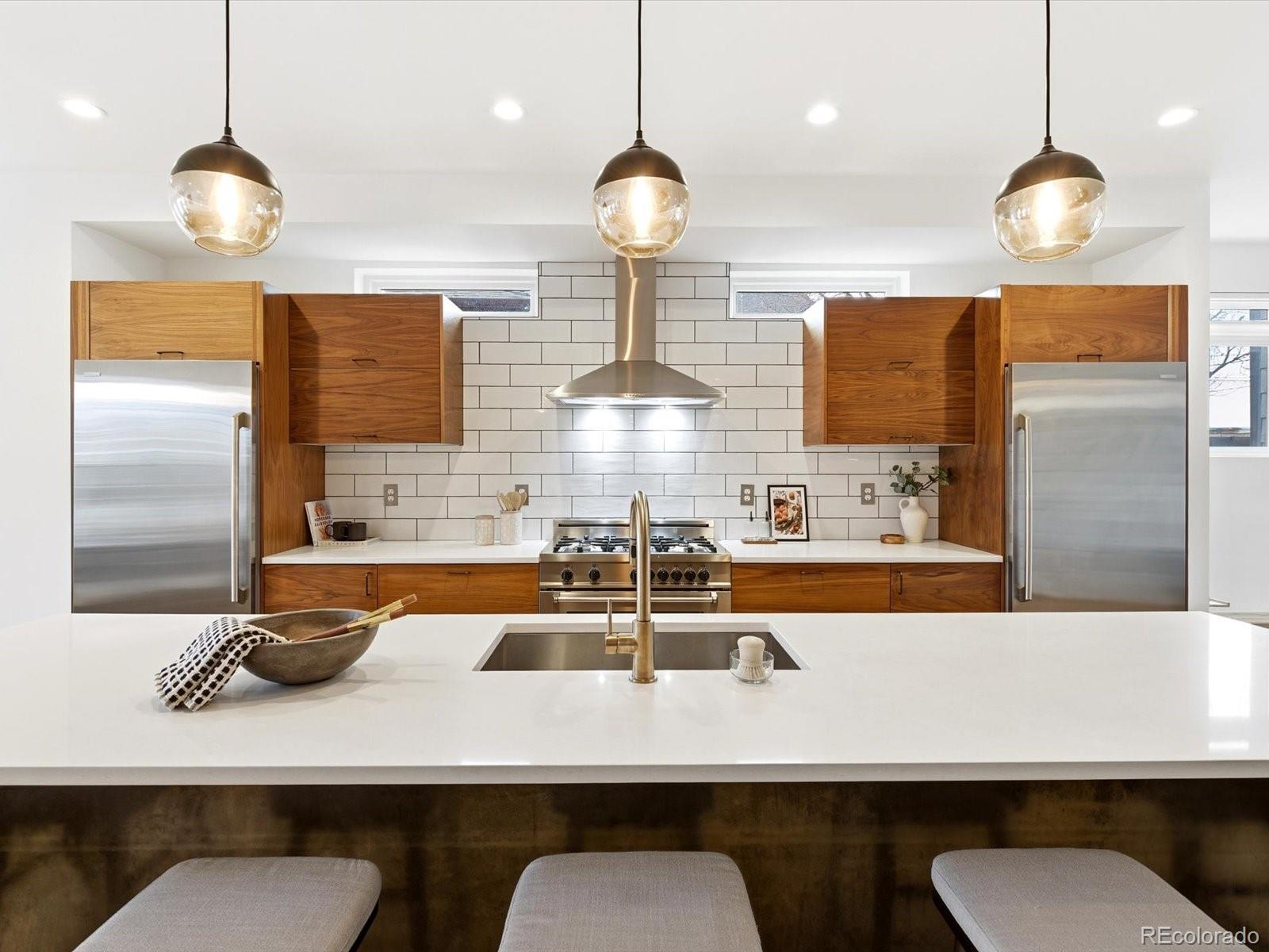 4141 Shoshone Street Denver, CO 80211 - Photo 10 of 50 a kitchen with a counter space and chairs