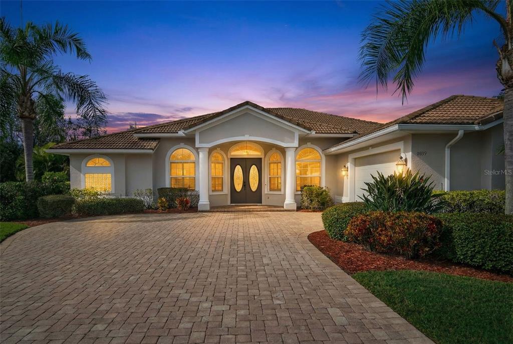 a front view of a house with garden