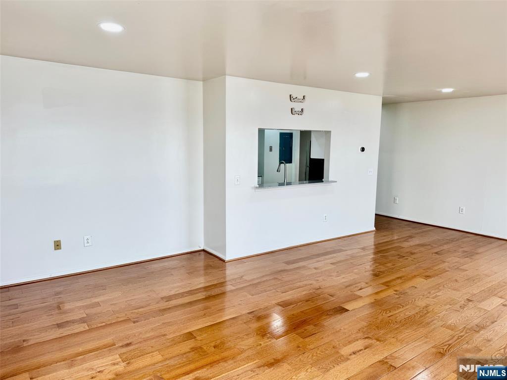 34 Bergen Ridge Road, Unit 2 North Bergen, NJ 07047 - Photo 6 of 41 a view of an empty room with wooden floor