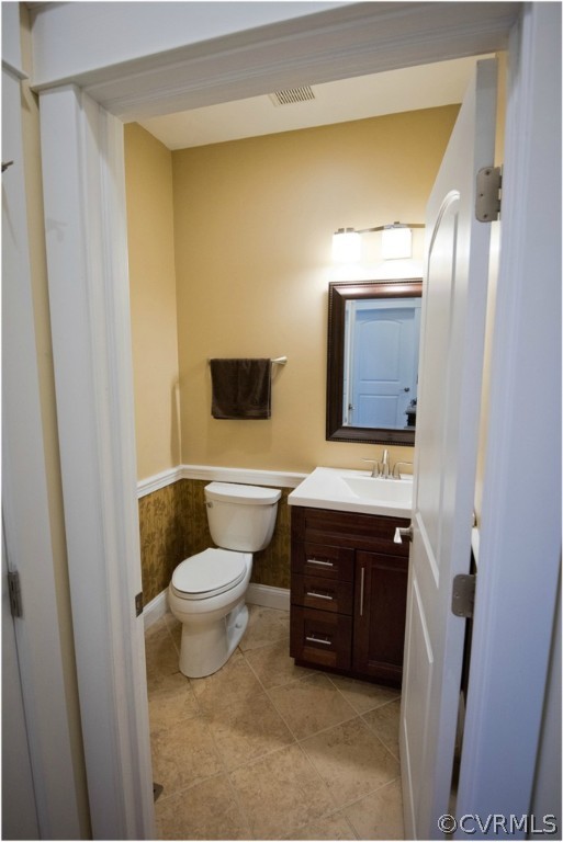3822 Baldwin Road Chester, VA 23831 - Photo 13 of 22 a bathroom with a sink a toilet and mirror
