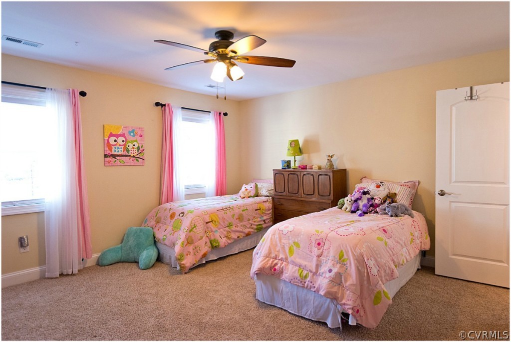 3822 Baldwin Road Chester, VA 23831 - Photo 17 of 22 a bedroom with two beds and a chandelier