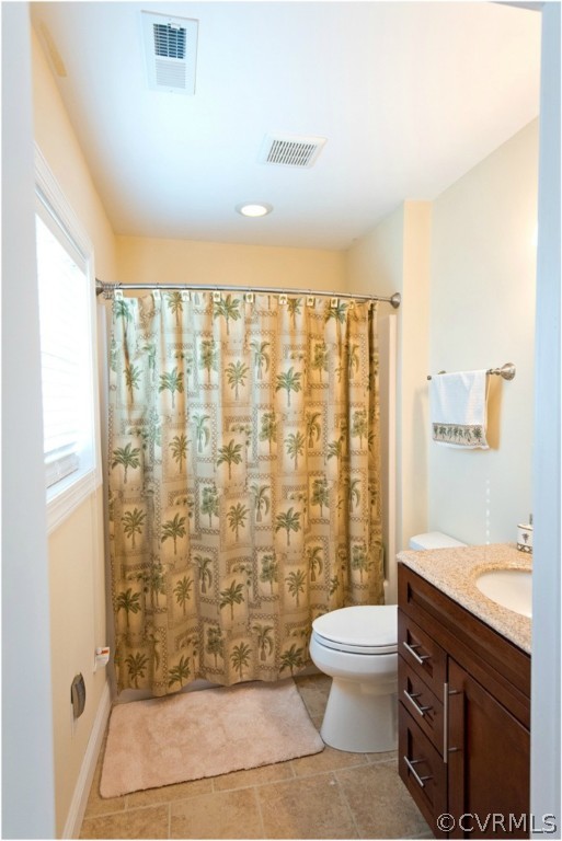 3822 Baldwin Road Chester, VA 23831 - Photo 18 of 22 a bathroom with a shower toilet and sink