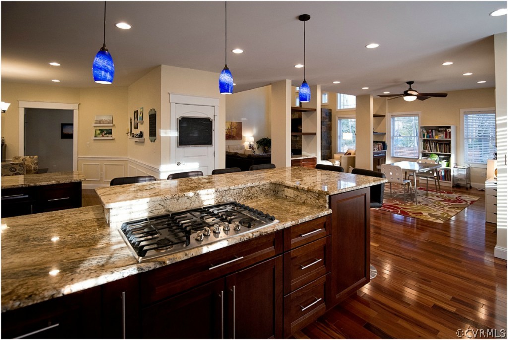 3822 Baldwin Road Chester, VA 23831 - Photo 6 of 22 a kitchen with stainless steel appliances granite countertop a stove and a view of living room