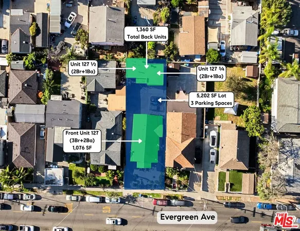 an aerial view of multi story residential apartment building and parking space