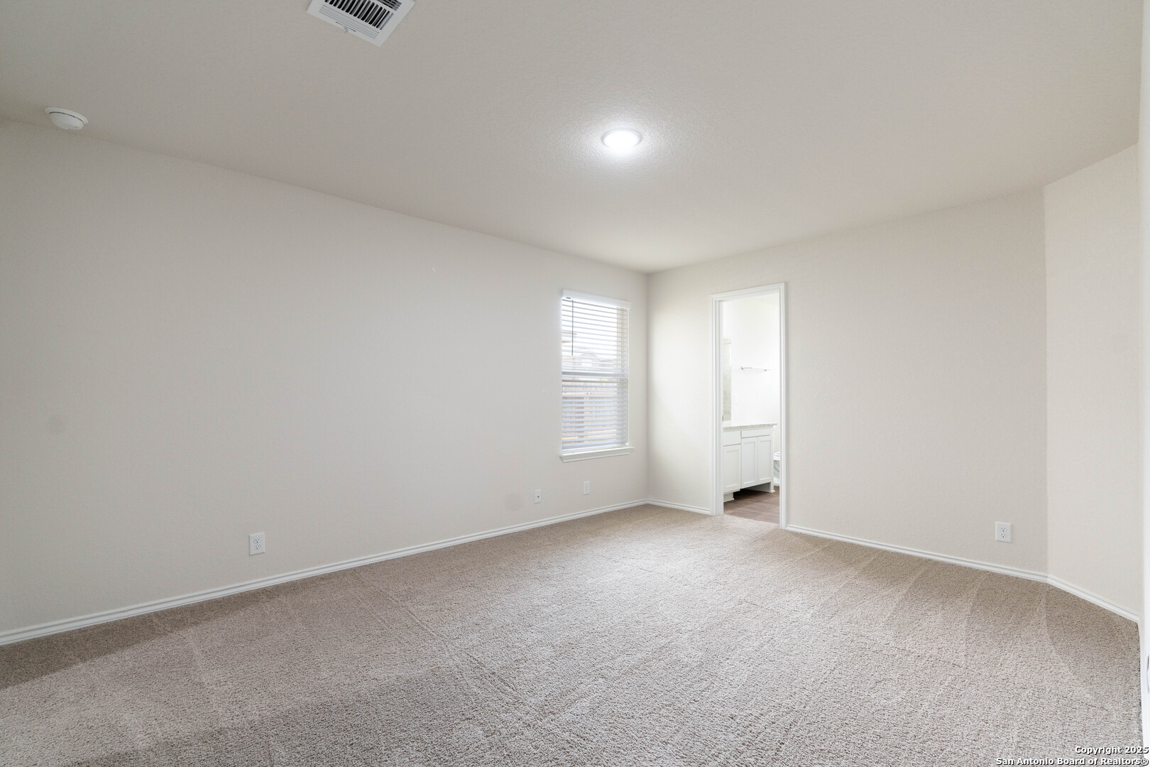 6806 Rondo Measure San Antonio, TX 78252 - Photo 15 of 25 a view of an empty room with a window