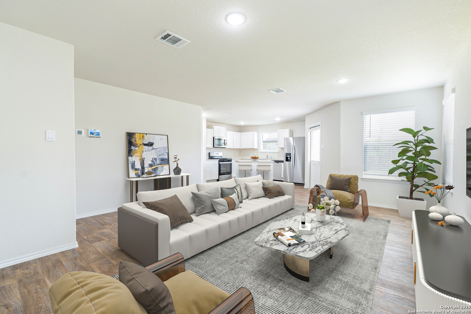 6806 Rondo Measure San Antonio, TX 78252 - Photo 7 of 25 a living room with furniture couches and a potted plant on a dresser
