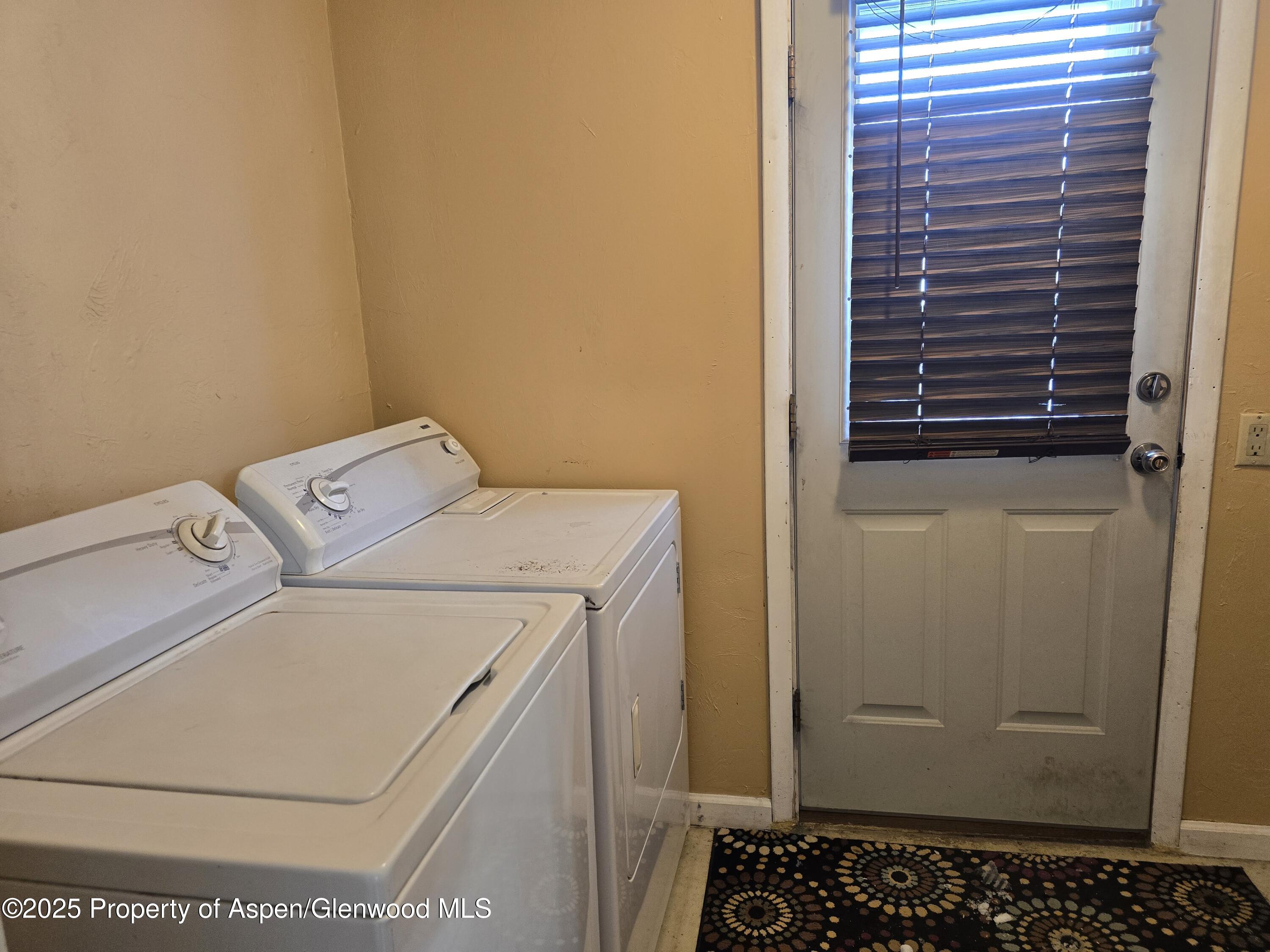 354 School Street Craig, CO 81625 - Photo 12 of 26 a utility room with dryer and washer