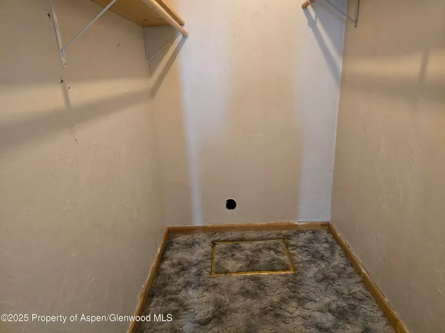 a view of a house with a wooden fence
