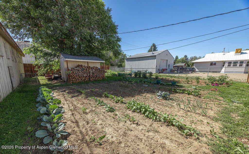 354 School Street Craig, CO 81625 - Photo 19 of 26 a view of a house with a yard