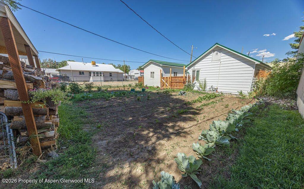354 School Street Craig, CO 81625 - Photo 20 of 26 a view of a house with a yard
