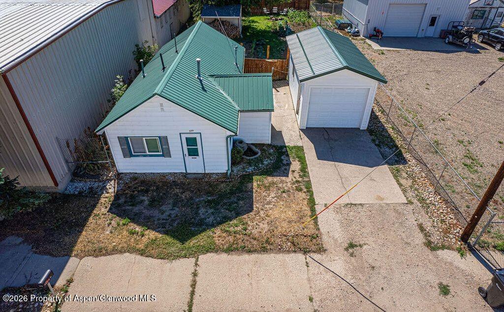 354 School Street Craig, CO 81625 - Photo 2 of 26 an aerial view of a house with large trees