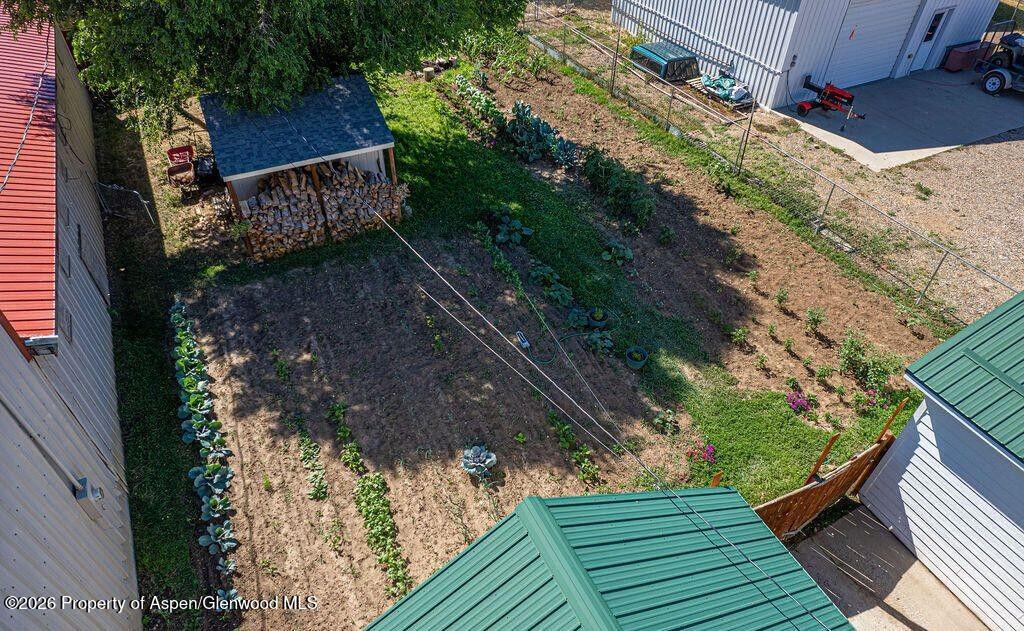 354 School Street Craig, CO 81625 - Photo 25 of 26 a view of a backyard with wooden fence