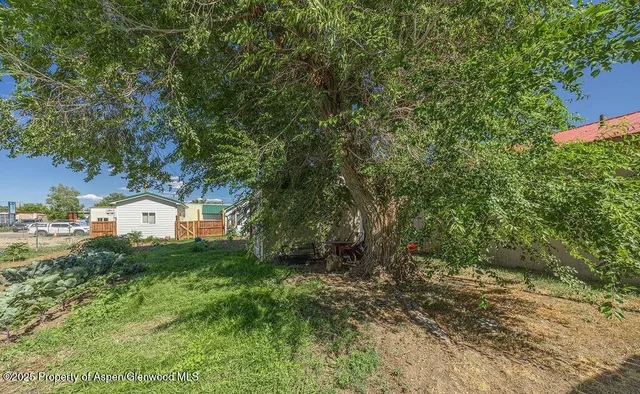 a view of a wooden fence with a bench