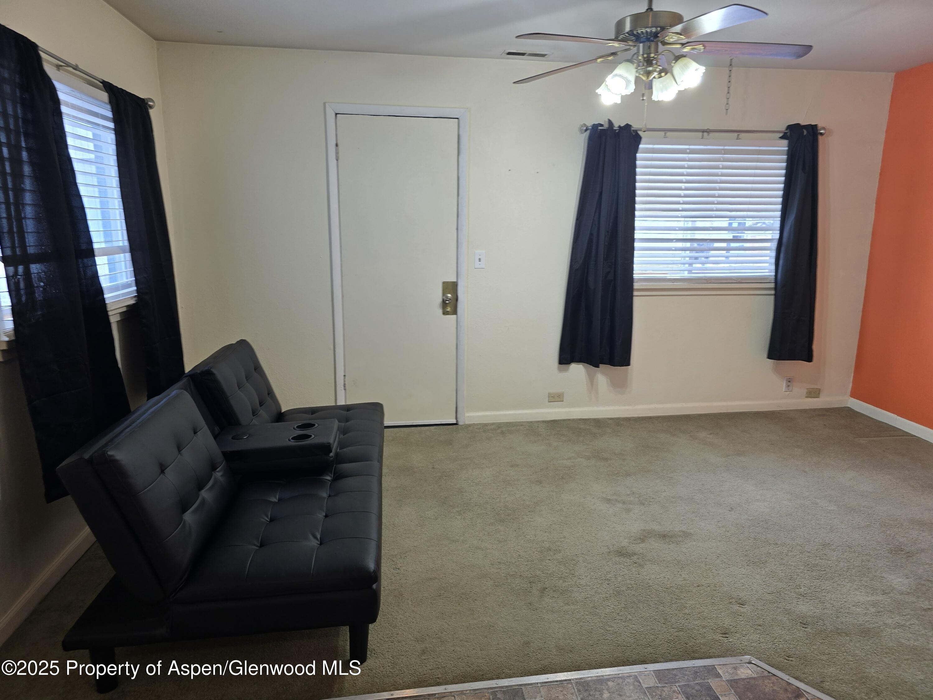 354 School Street Craig, CO 81625 - Photo 6 of 26 a living room with furniture and a flat screen tv
