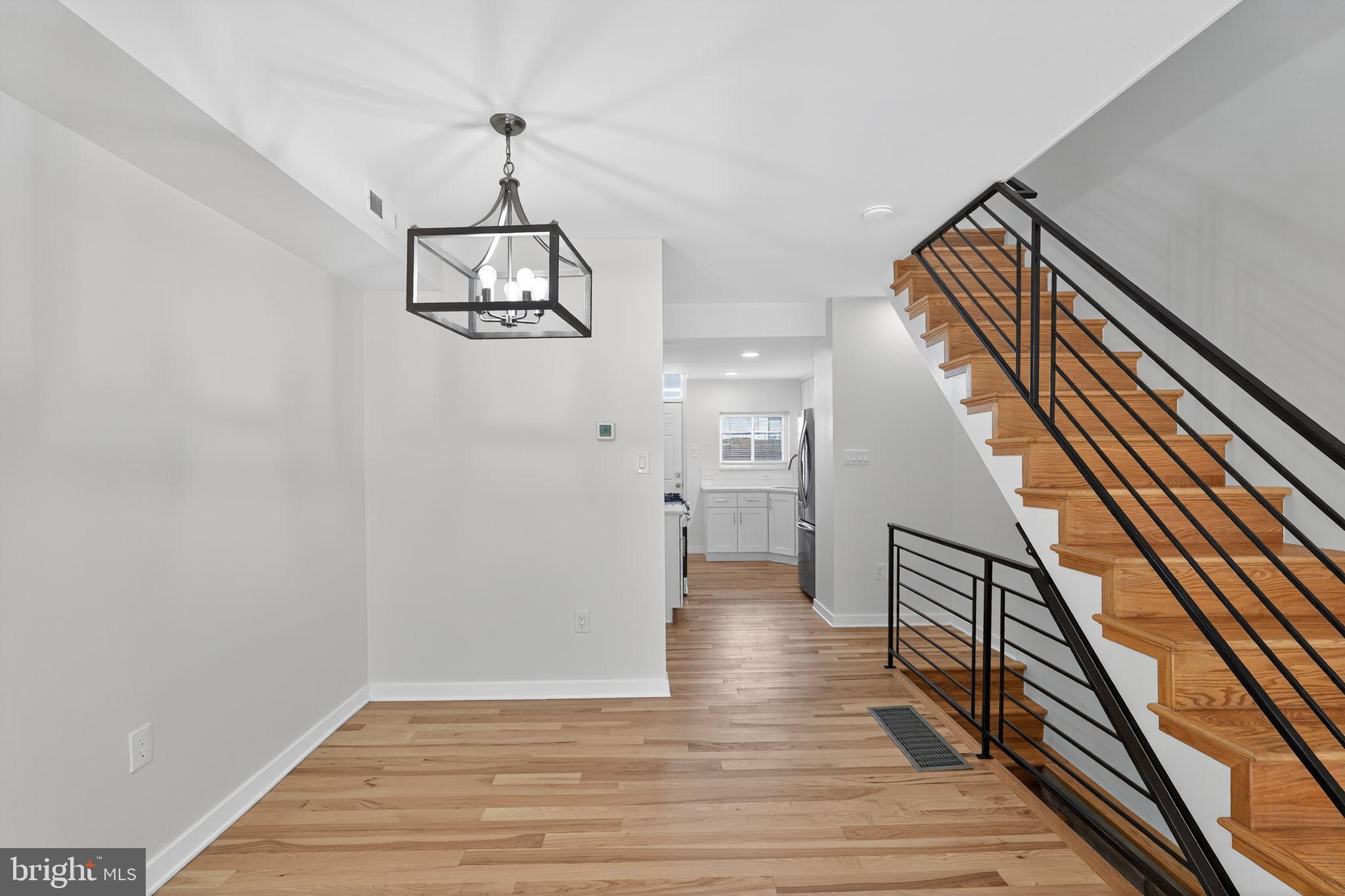 615 Sigel Street Philadelphia, PA 19148 - Photo 16 of 28 a view of a hallway with wooden floor and staircase