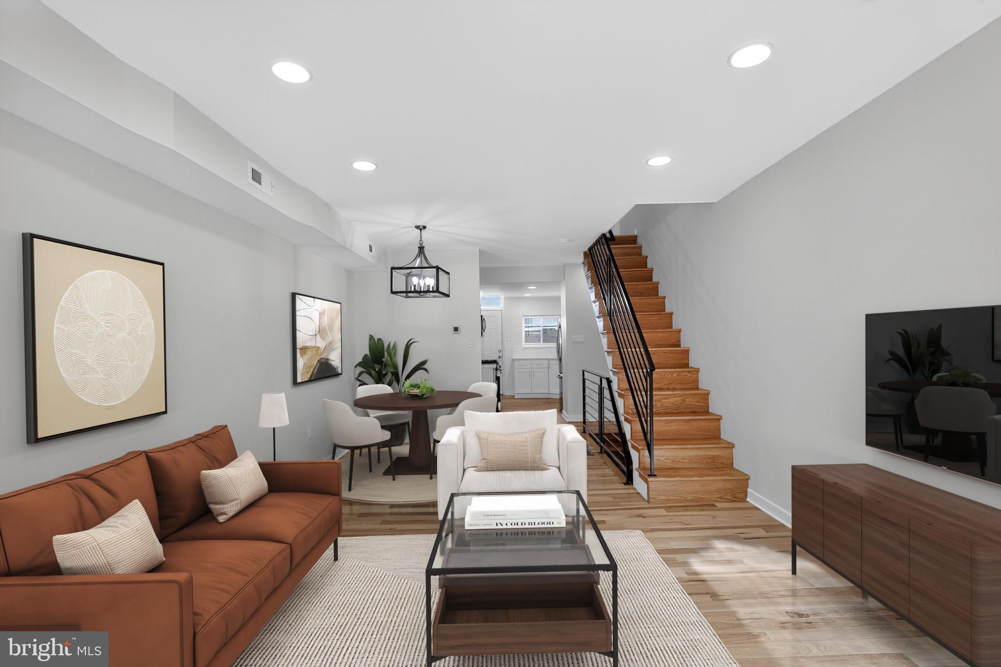 615 Sigel Street Philadelphia, PA 19148 - Photo 2 of 28 a living room with furniture and a flat screen tv