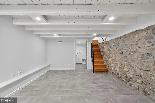a view of an empty room with stairs