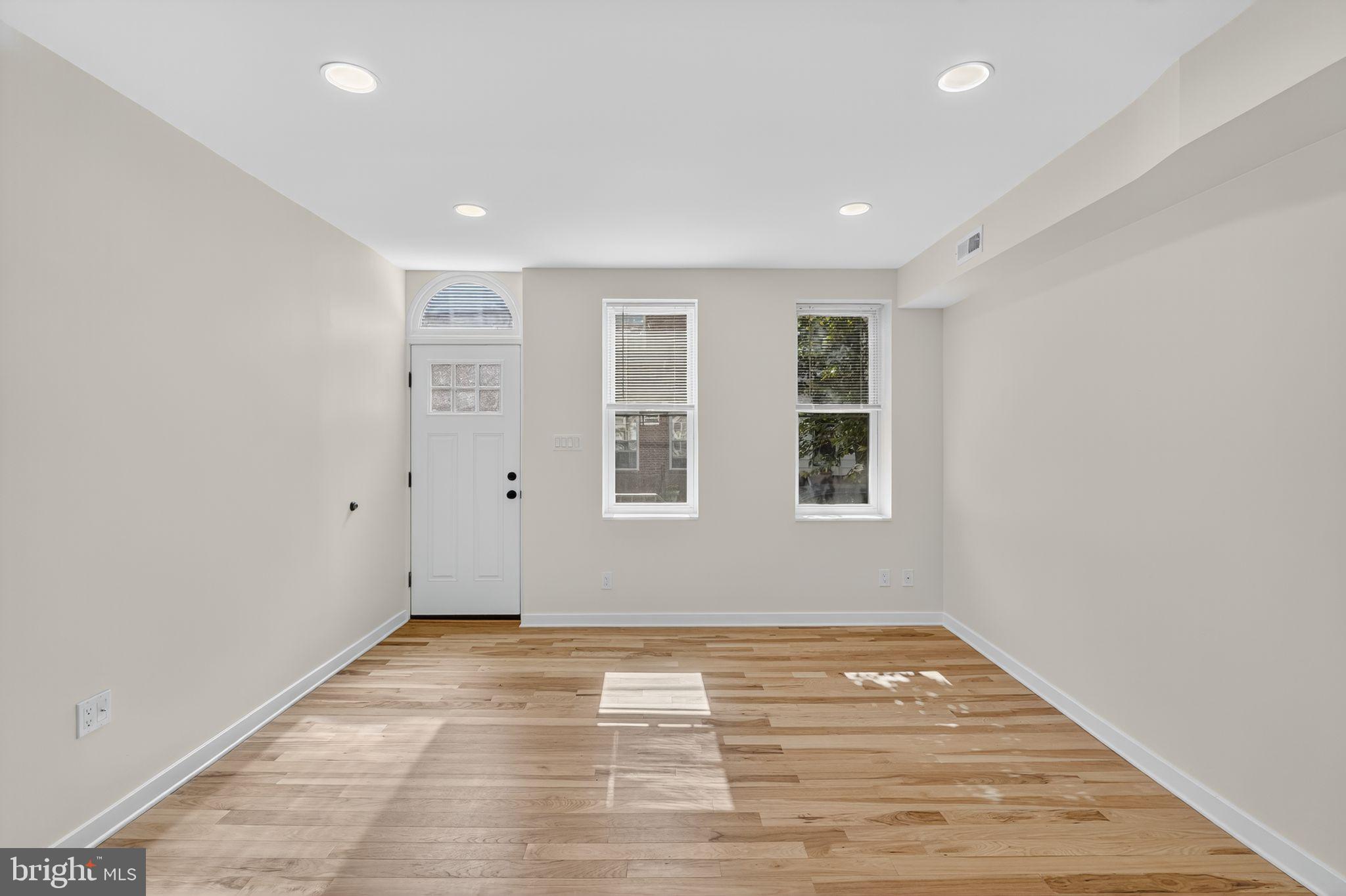 615 Sigel Street Philadelphia, PA 19148 - Photo 4 of 28 a view of empty room with wooden floor and fan