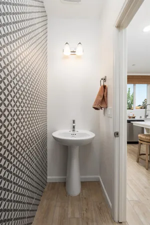 a bathroom with a sink and mirror