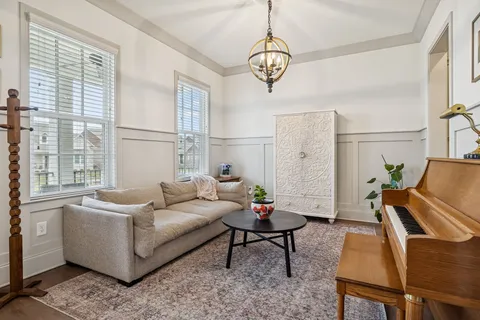 a living room with furniture fireplace and flat screen tv