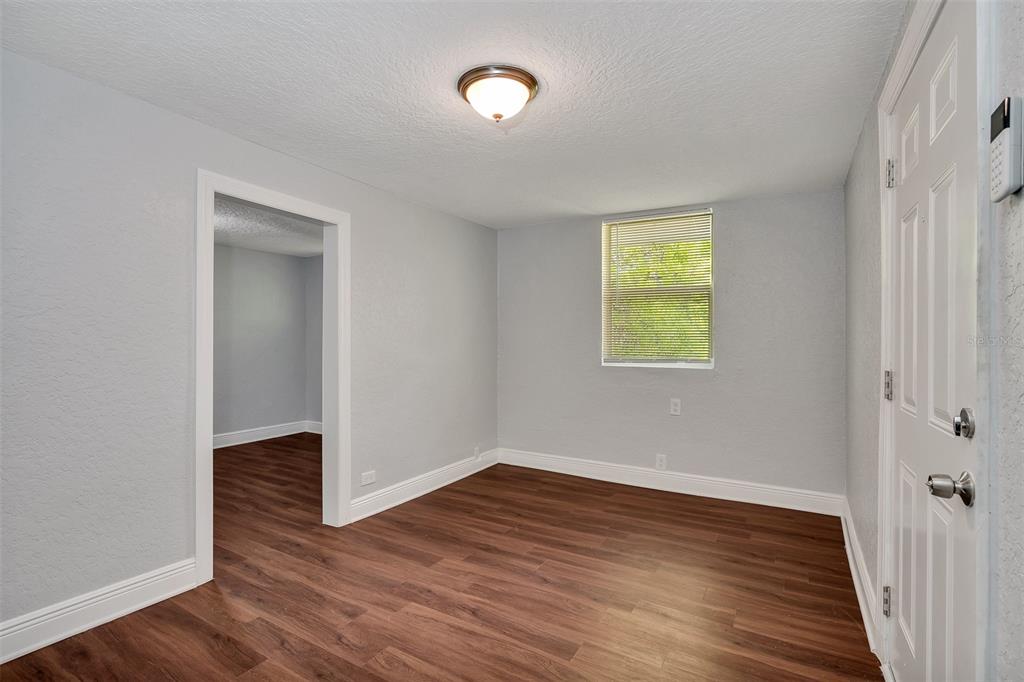 3106 North 17th Street, Unit C Tampa, FL 33605 - Photo 3 of 12 a view of an empty room with wooden floor