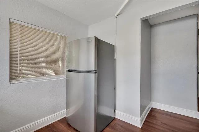 a view of closet area with wooden floor