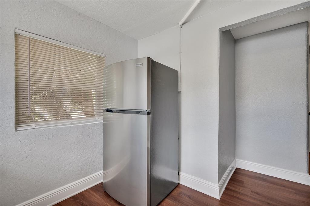 3106 North 17th Street, Unit C Tampa, FL 33605 - Photo 7 of 12 a view of closet area with wooden floor
