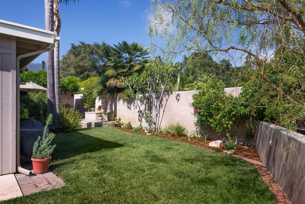 2123 Sycamore Canyon Road Santa Barbara, CA 93108 - Photo 14 of 15 a view of a backyard with potted plants and large tree