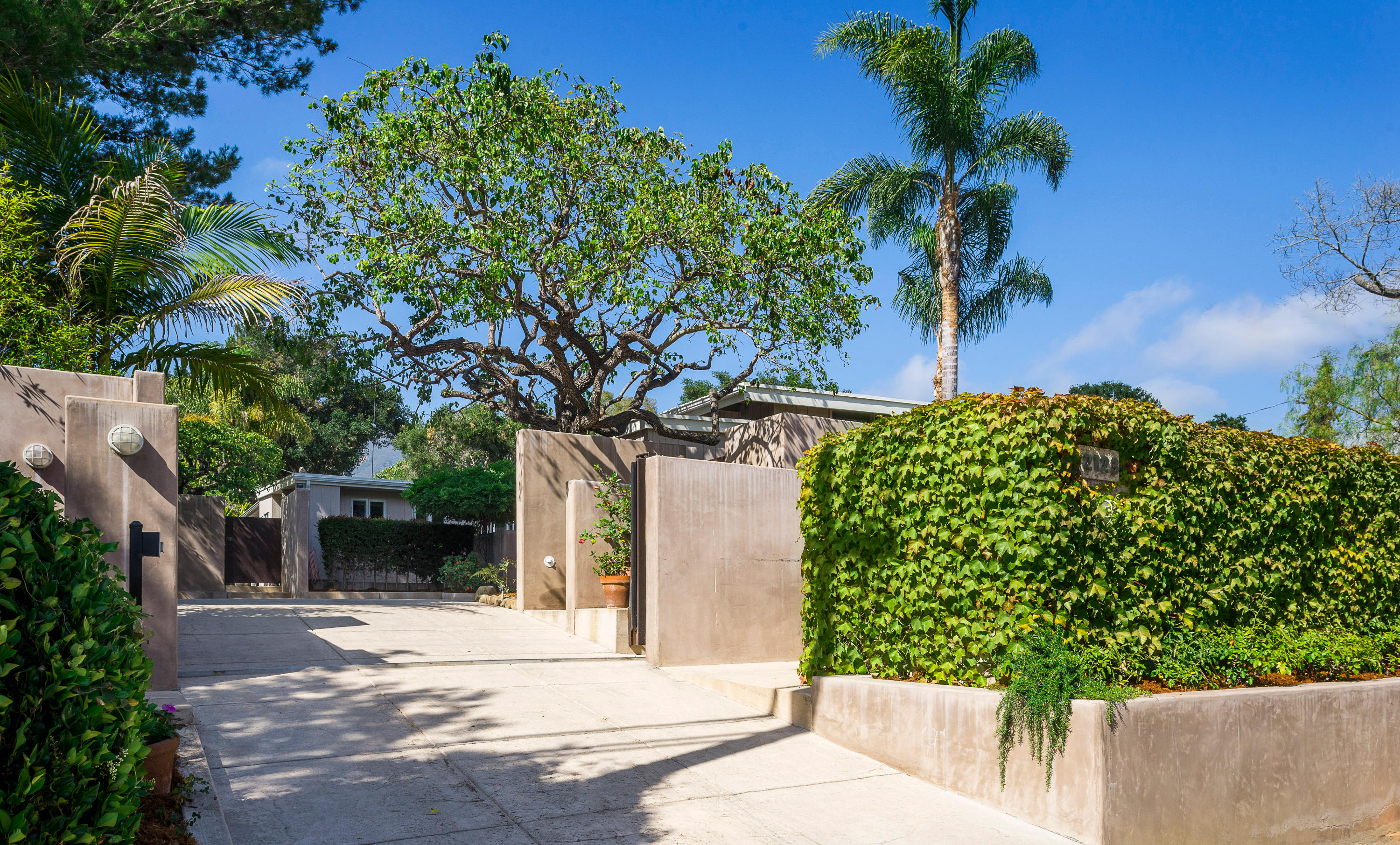 2123 Sycamore Canyon Road Santa Barbara, CA 93108 - Photo 2 of 15 front view of a house with a yard and potted plants