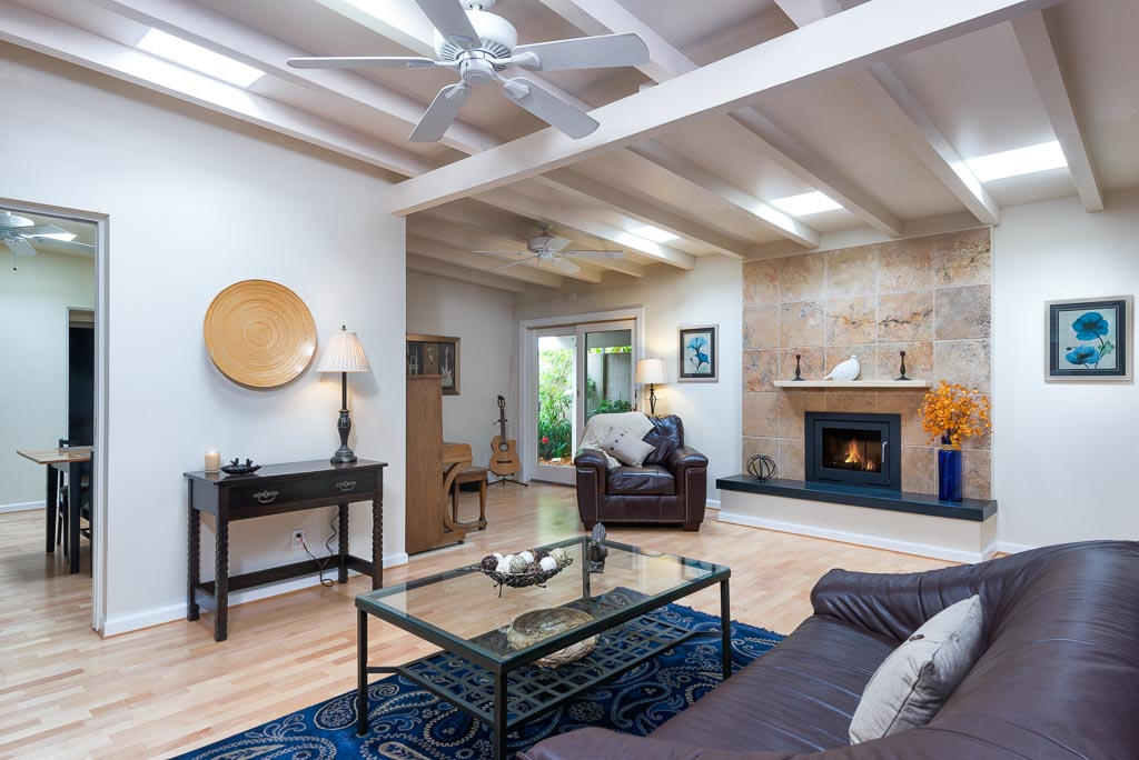 2123 Sycamore Canyon Road Santa Barbara, CA 93108 - Photo 3 of 15 a living room with furniture a fireplace and a large window