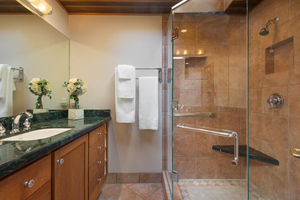 2123 Sycamore Canyon Road Santa Barbara, CA 93108 - Photo 10 of 15 a bathroom with a granite countertop shower sink and mirror