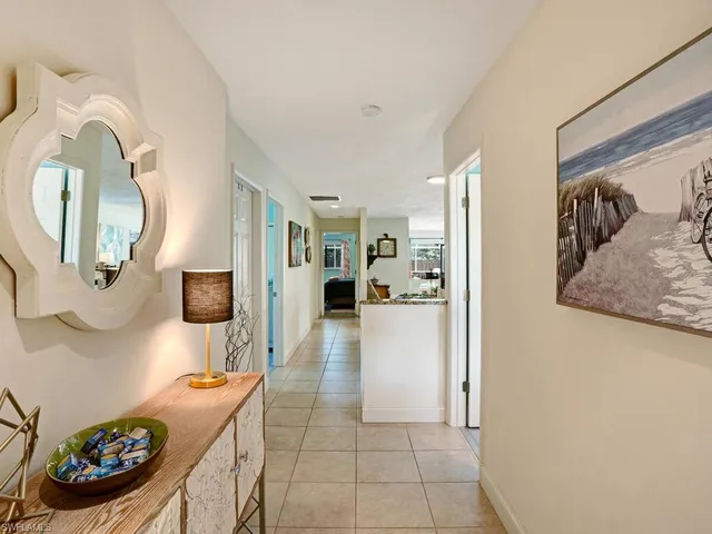 a hallway with a view of living room