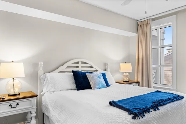 a bedroom with a bed and a night stand