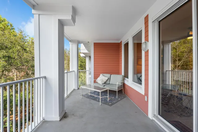 a balcony with outdoor seating and yard