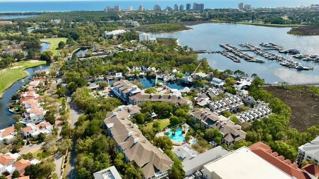 an aerial view of a houses with a lake and lake view