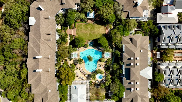 an aerial view of residential houses with outdoor space