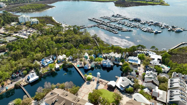 a picture of lake view with couple of cars parked in front of it