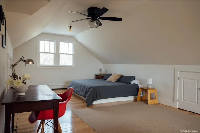 a living room with furniture a window and a table