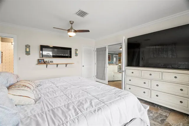 a view of walk in closet with clothes