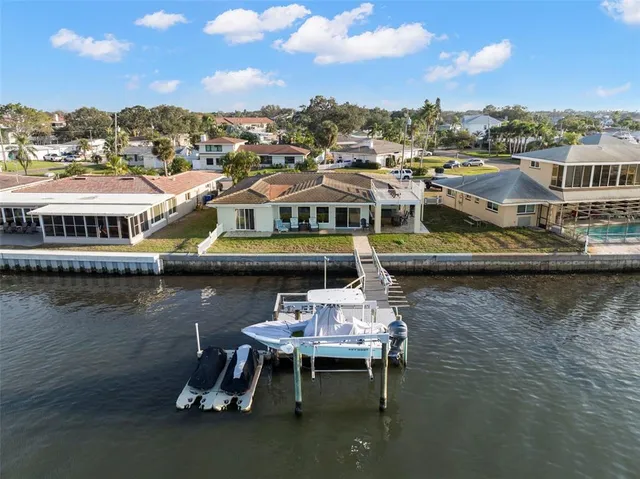 a view of a roof deck with lounge chairs