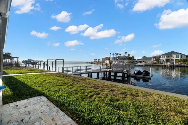 a view of a terrace with outdoor seating and city view