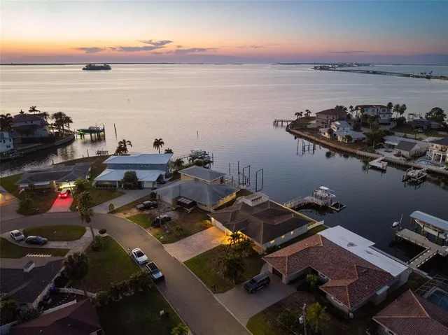 a view of a house with a wooden deck