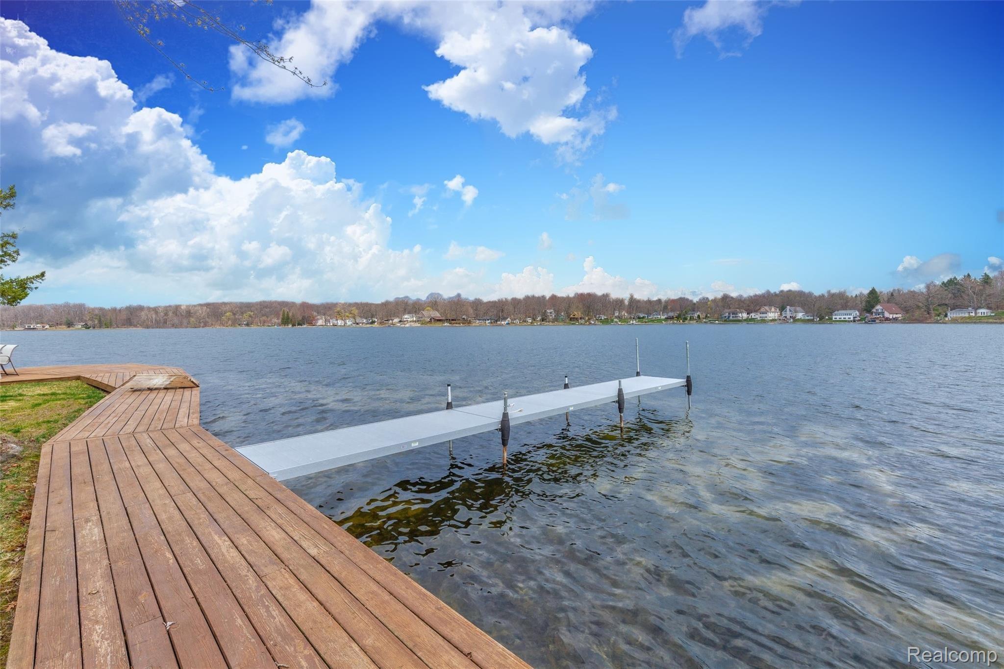 7784 Tipsico Lake Road Holly, MI 48442 - Photo 7 of 55 Wrap around boardwalk with dock