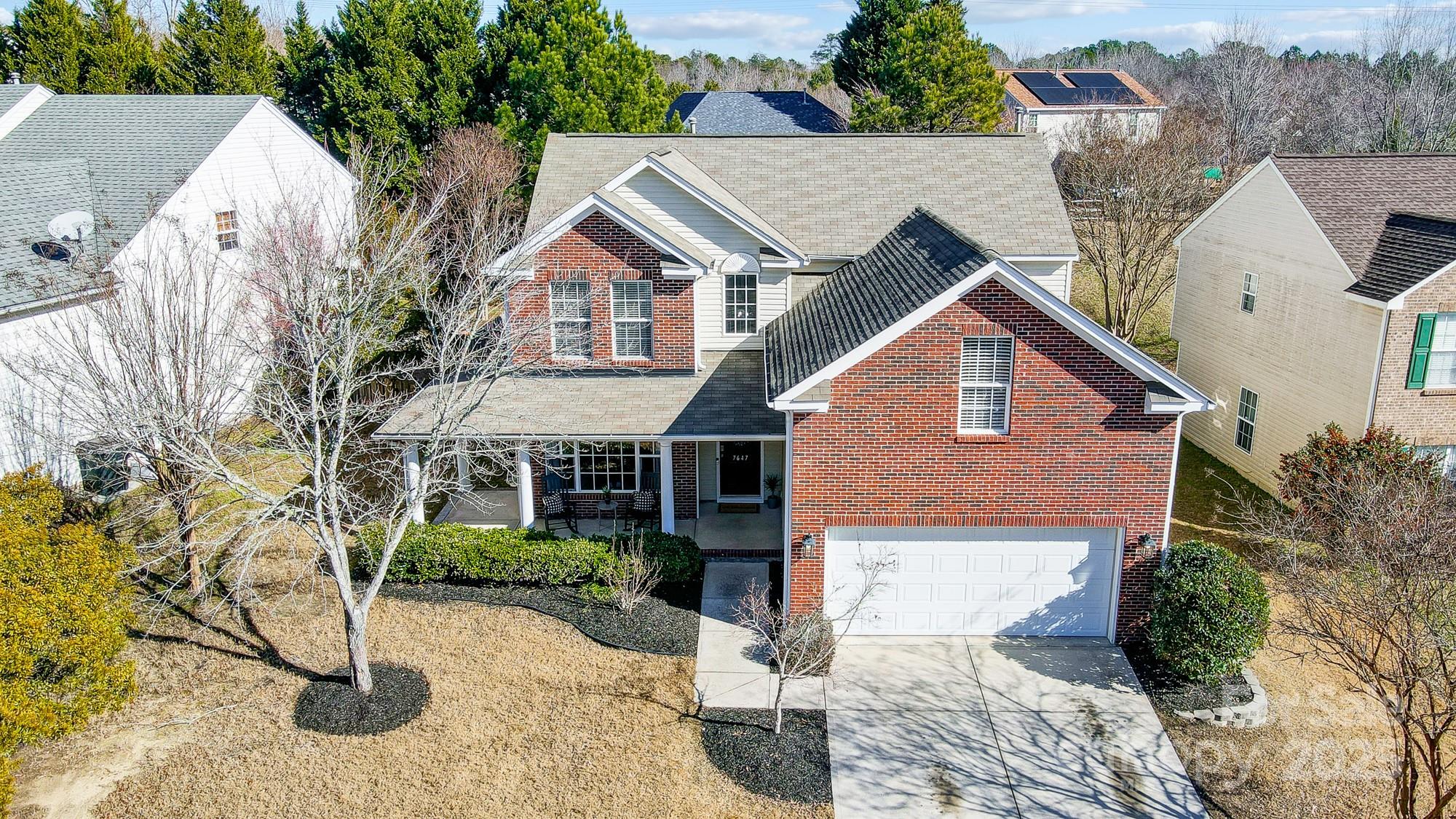 7647 Black Hawk Lane Tega Cay, SC 29708 - Photo 2 of 42 a view of house with yard