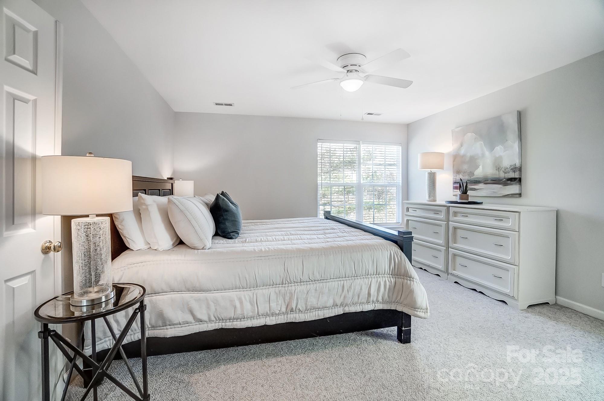 7647 Black Hawk Lane Tega Cay, SC 29708 - Photo 21 of 42 a bedroom with a bed and window