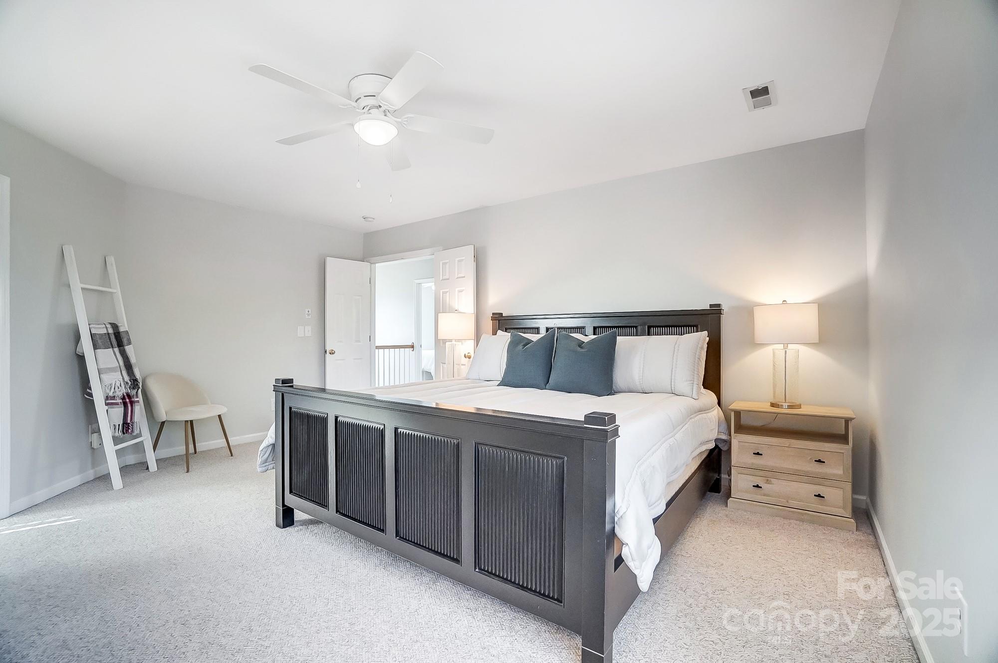 7647 Black Hawk Lane Tega Cay, SC 29708 - Photo 22 of 42 a bed room with a bed and a chair