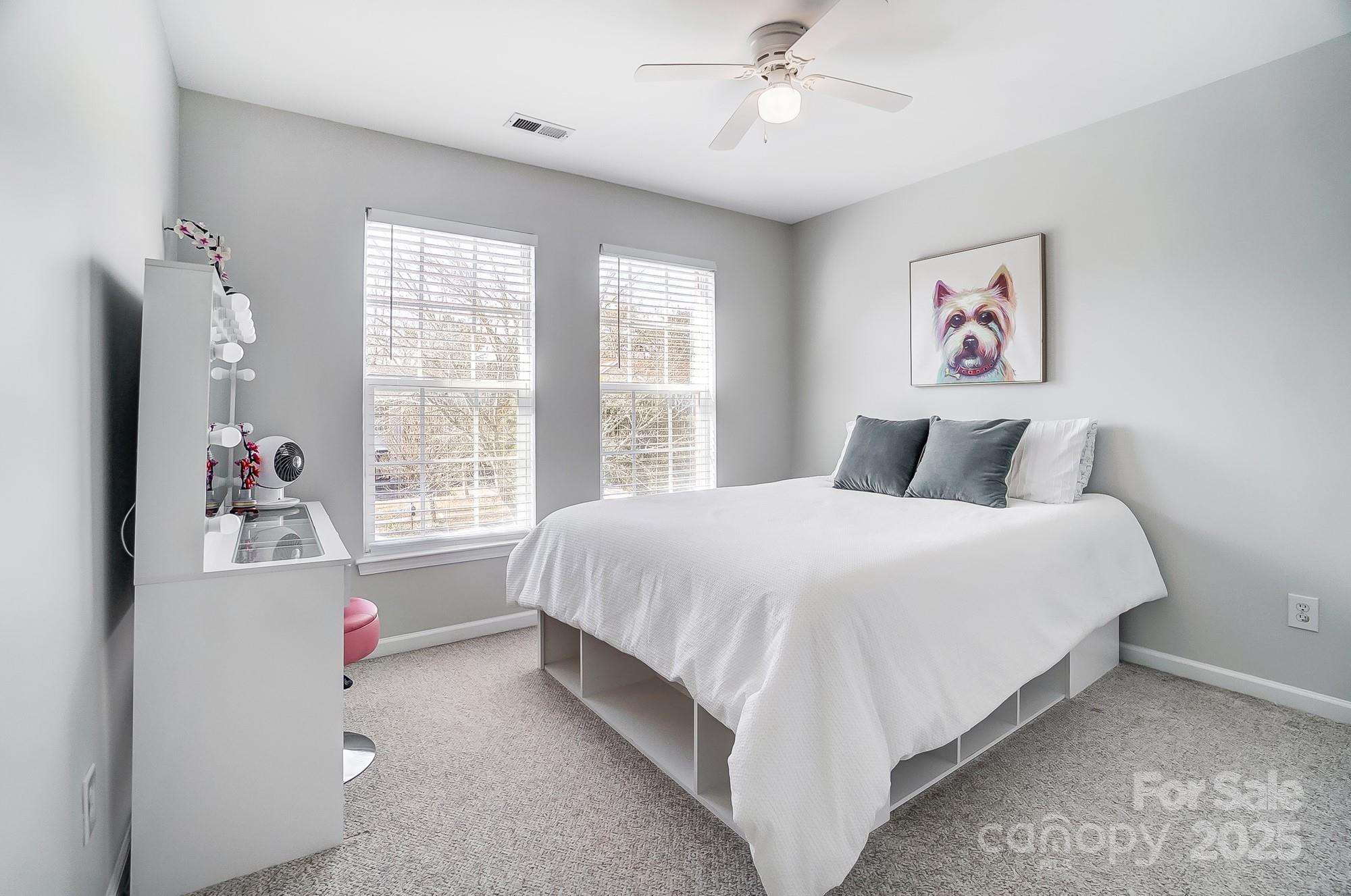 7647 Black Hawk Lane Tega Cay, SC 29708 - Photo 26 of 42 a bedroom with a large bed and a window