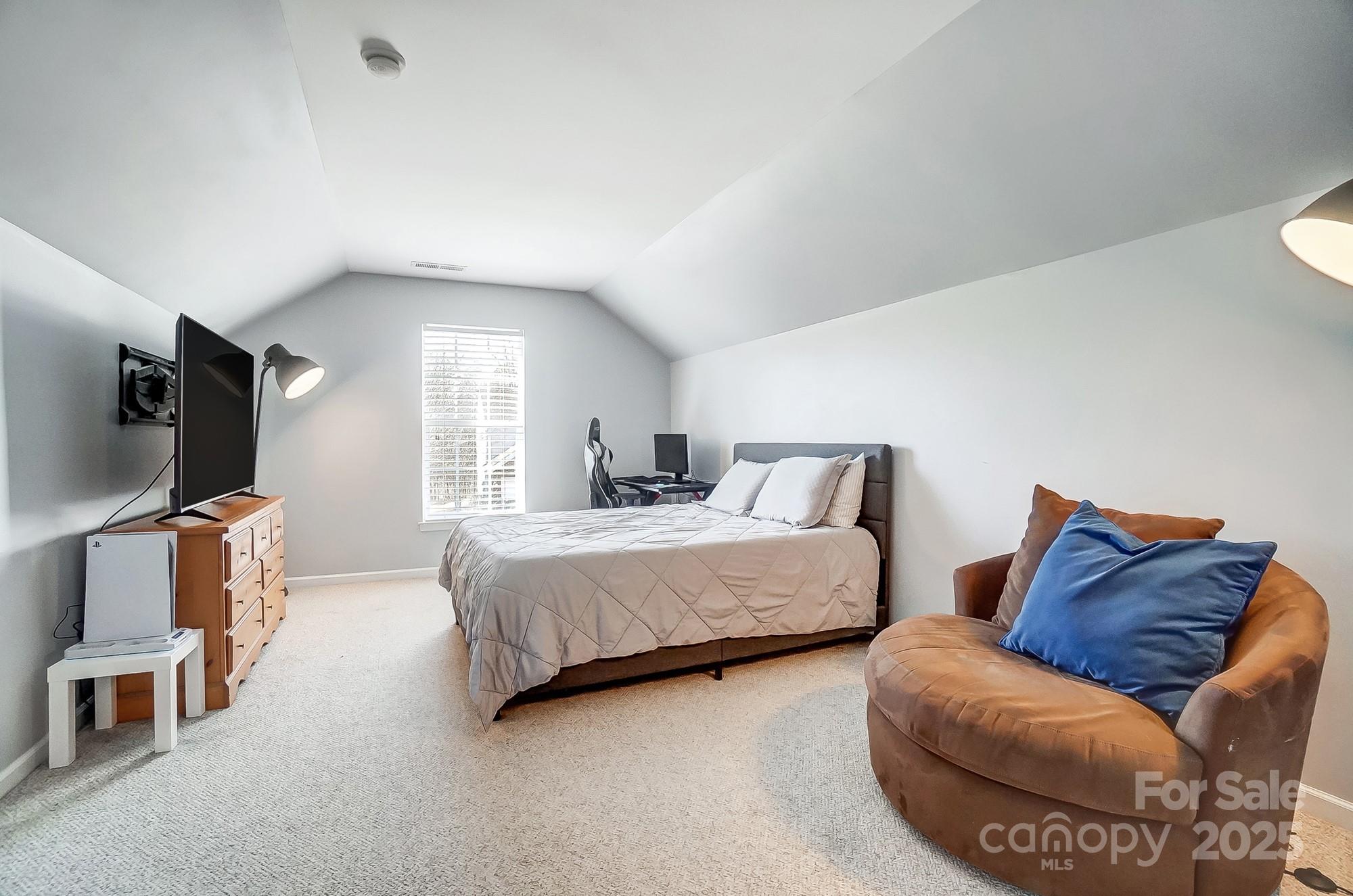 7647 Black Hawk Lane Tega Cay, SC 29708 - Photo 30 of 42 a living room with furniture and a flat screen tv