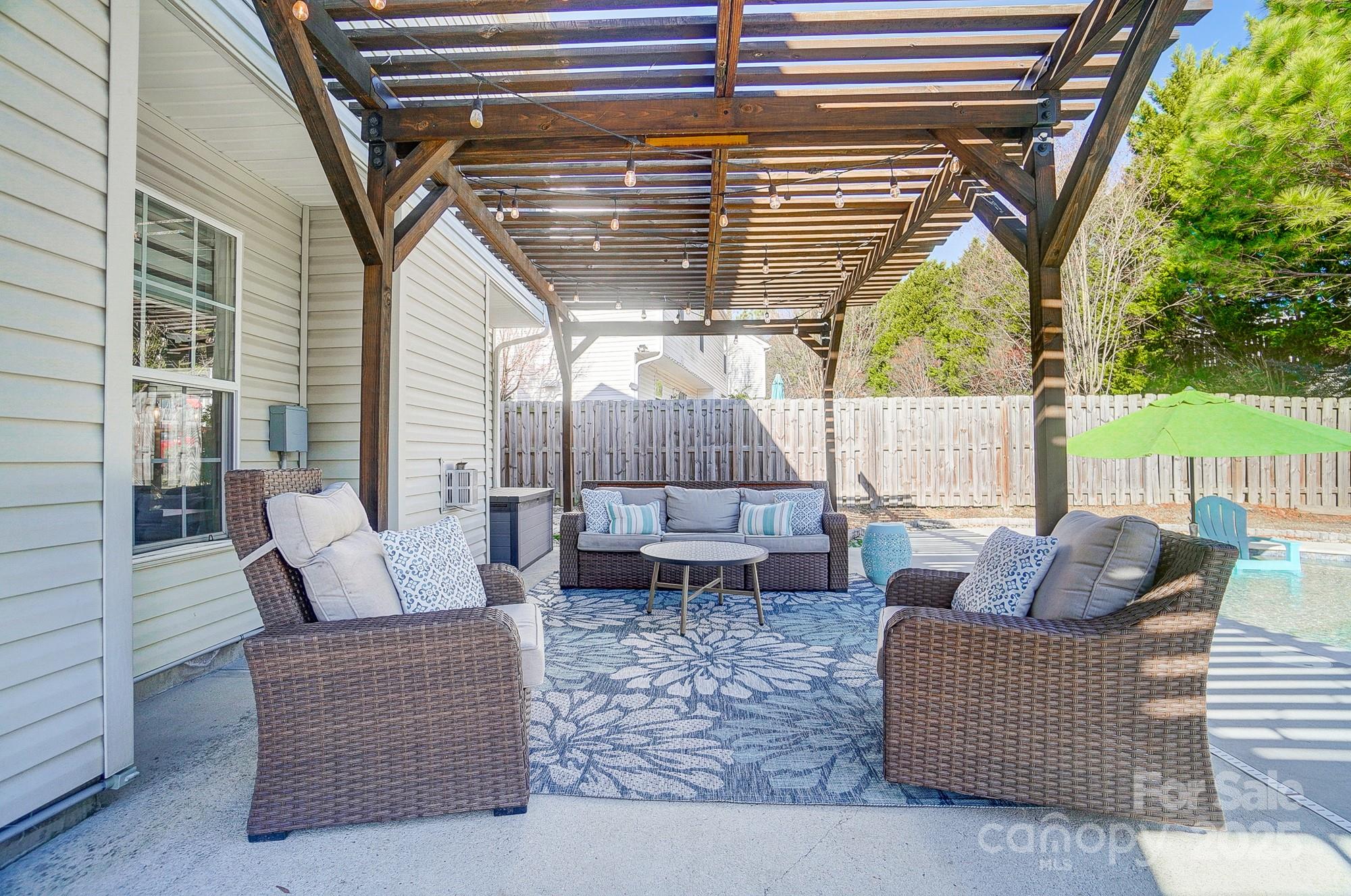 7647 Black Hawk Lane Tega Cay, SC 29708 - Photo 31 of 42 a outdoor living space with patio furniture and a potted plant